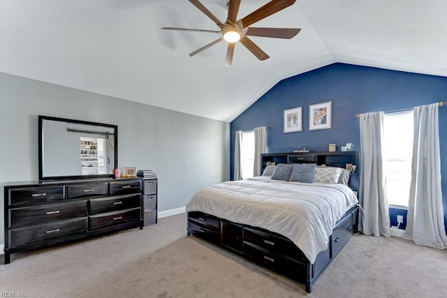 bedroom with light carpet, ceiling fan, and lofted ceiling