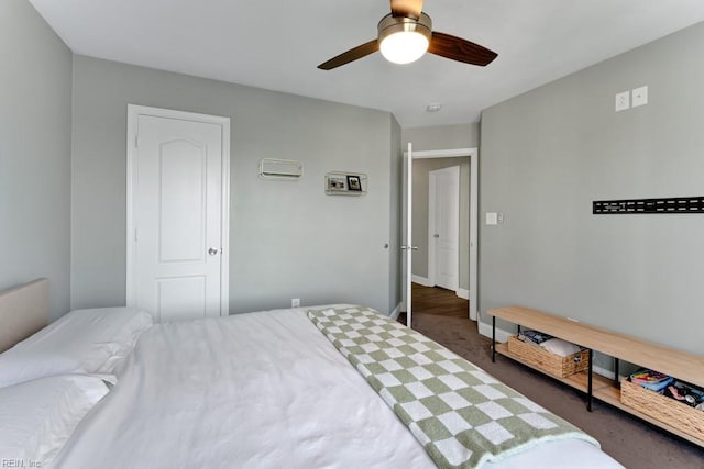 bedroom featuring ceiling fan and dark colored carpet