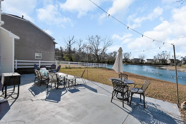 view of patio with a water view