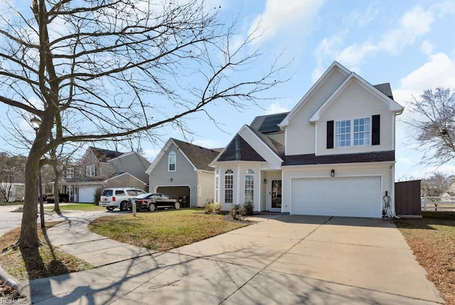 view of front of house featuring a front lawn and a garage