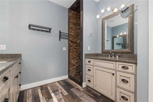 bathroom with wood-type flooring and vanity