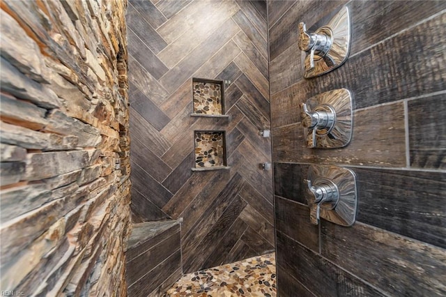 bathroom with a tile shower