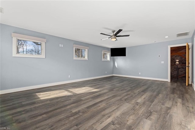 unfurnished room featuring ceiling fan and dark hardwood / wood-style floors