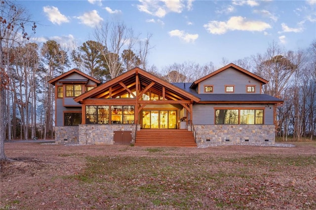 back of property with covered porch