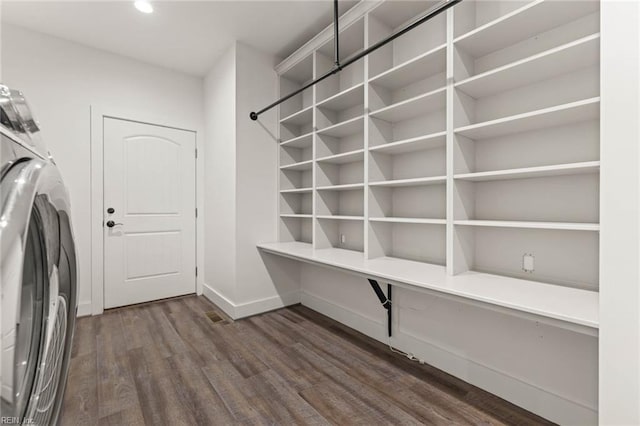 laundry area featuring dark wood-type flooring and washer / clothes dryer