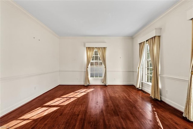 spare room featuring ornamental molding and dark wood-type flooring