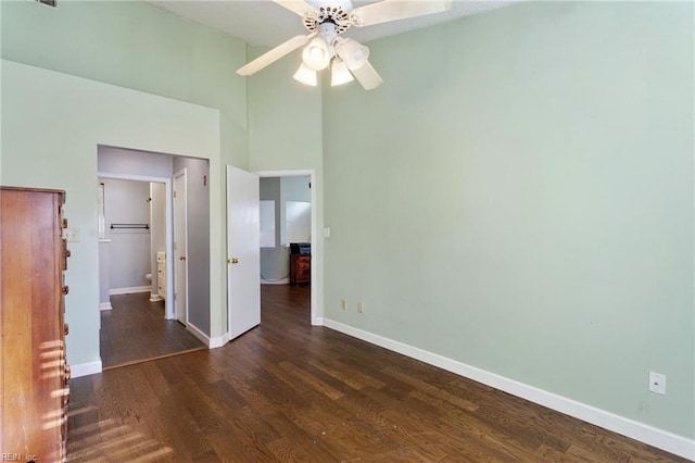 unfurnished bedroom with ceiling fan and dark hardwood / wood-style floors