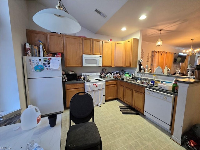 kitchen with lofted ceiling, sink, an inviting chandelier, white appliances, and hanging light fixtures