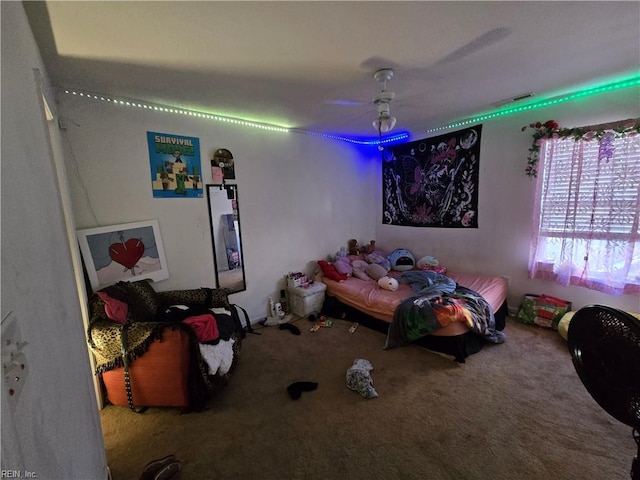 bedroom with ceiling fan and carpet flooring