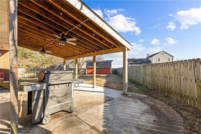 view of patio with a storage unit and ceiling fan