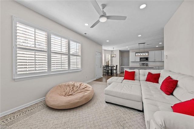 living room featuring ceiling fan