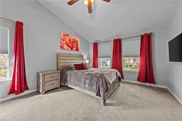 carpeted bedroom with vaulted ceiling and ceiling fan