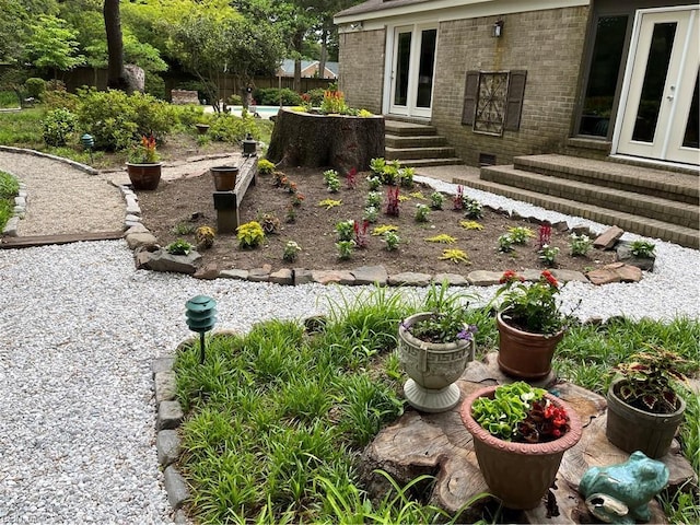 view of yard with french doors