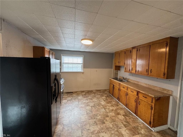 kitchen with black fridge and sink