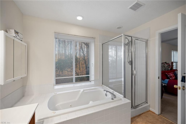 bathroom with shower with separate bathtub, tile patterned floors, and vanity