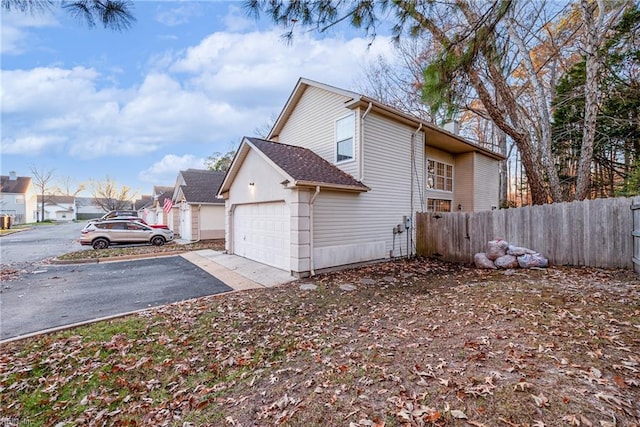 view of property exterior featuring a garage