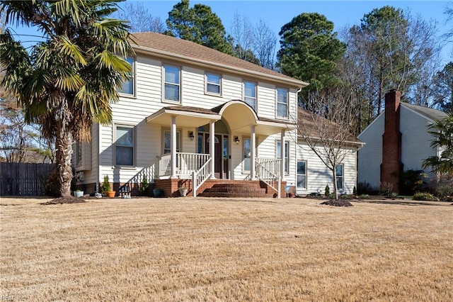 view of front of house featuring a front yard and a porch