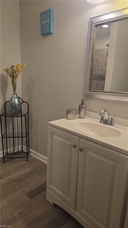 bathroom with vanity and wood-type flooring