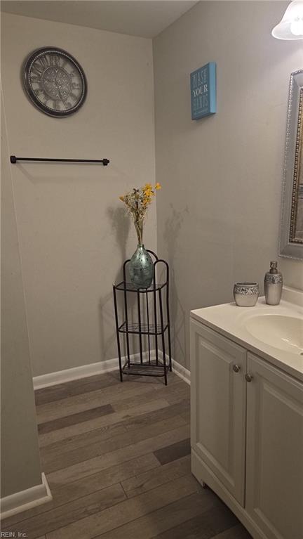 bathroom featuring vanity and hardwood / wood-style floors