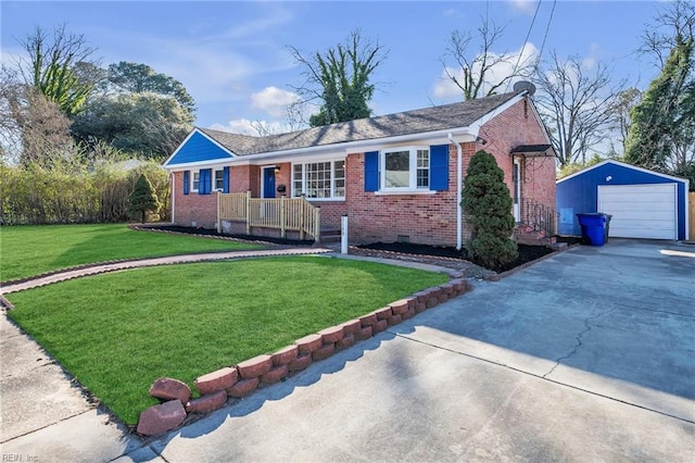 ranch-style home with a front yard, a garage, and an outbuilding