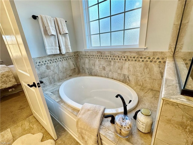 bathroom featuring a bathing tub and tile patterned floors