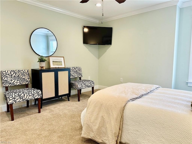 carpeted bedroom featuring ceiling fan and ornamental molding