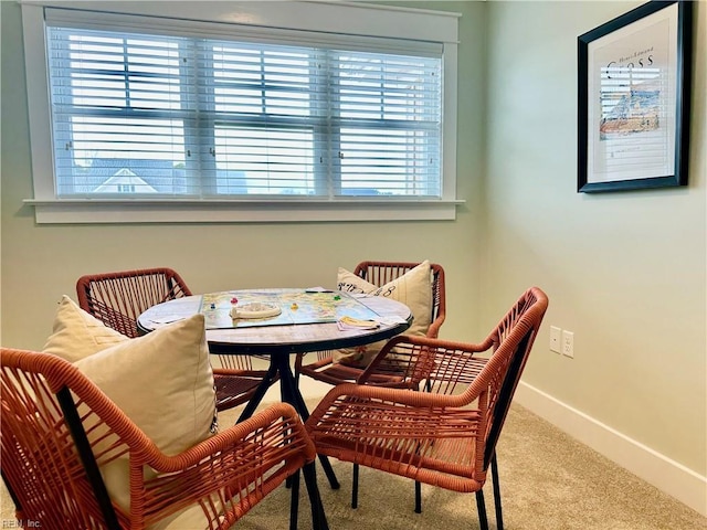 view of carpeted dining space