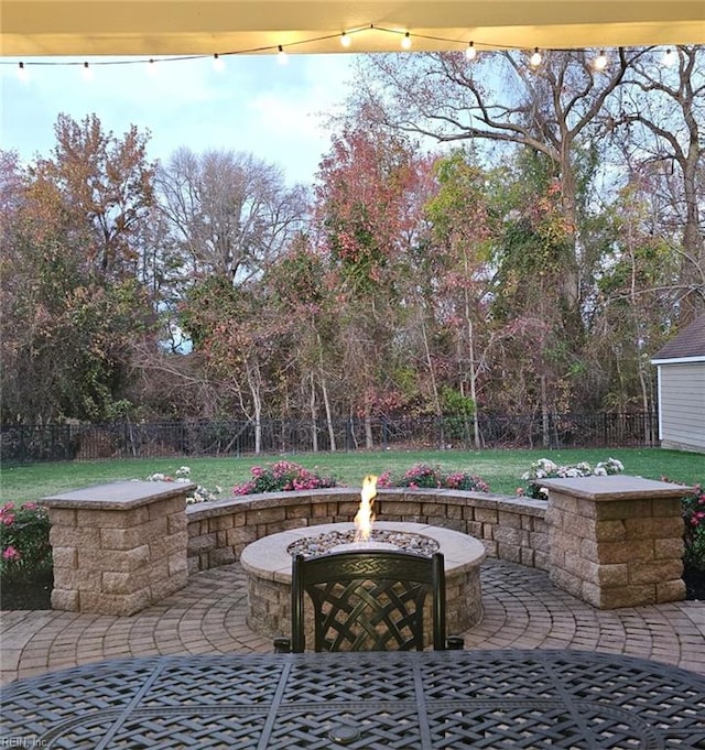 view of patio with a fire pit