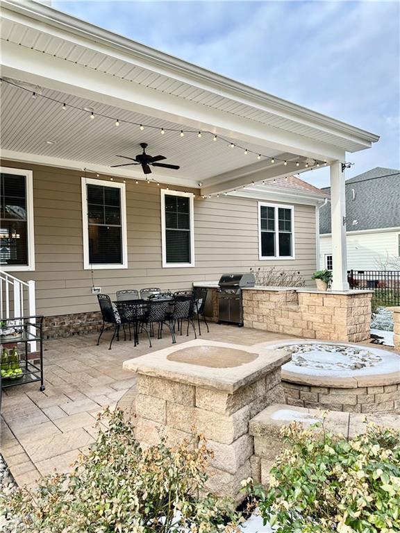 view of patio with grilling area, ceiling fan, and area for grilling