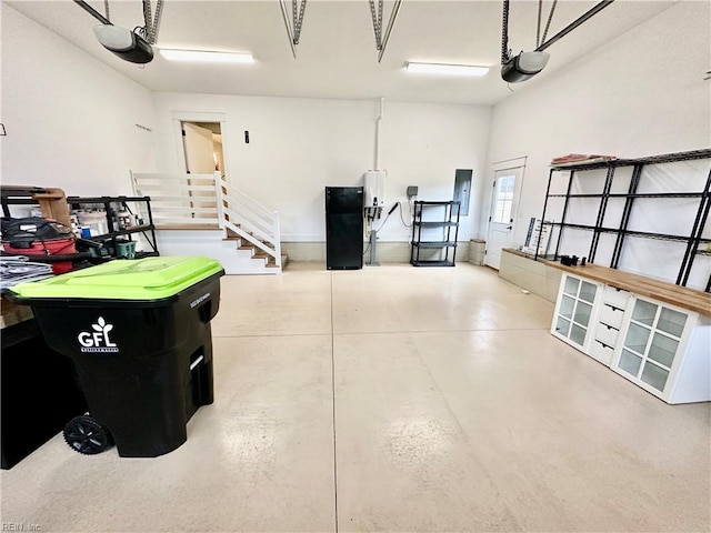 garage with electric panel and a garage door opener