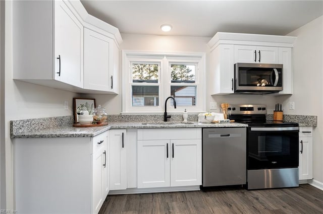 kitchen featuring sink, white cabinets, and appliances with stainless steel finishes