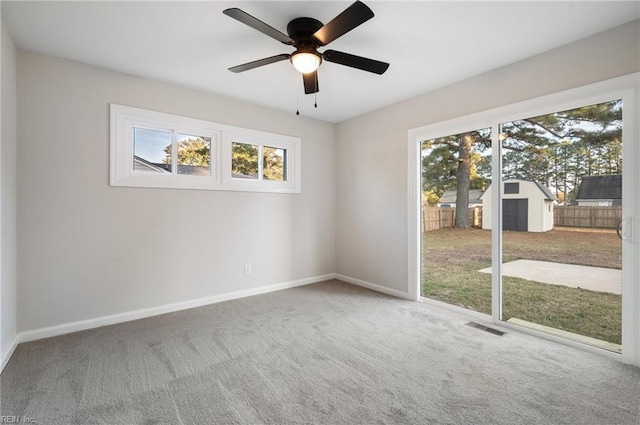 spare room with ceiling fan and carpet floors