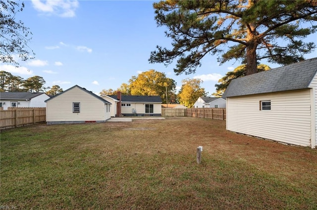 view of yard with a storage unit