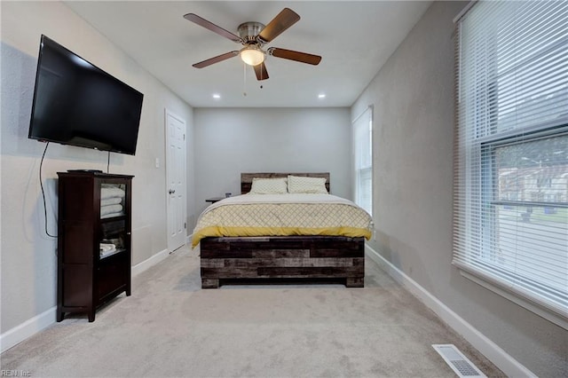 carpeted bedroom featuring ceiling fan