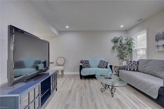 living room with light hardwood / wood-style flooring