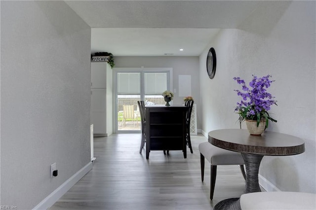 dining room with hardwood / wood-style floors