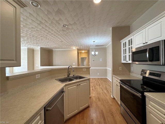 kitchen featuring sink, white cabinetry, and appliances with stainless steel finishes