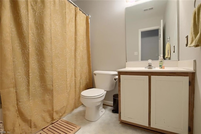 bathroom with toilet and vanity