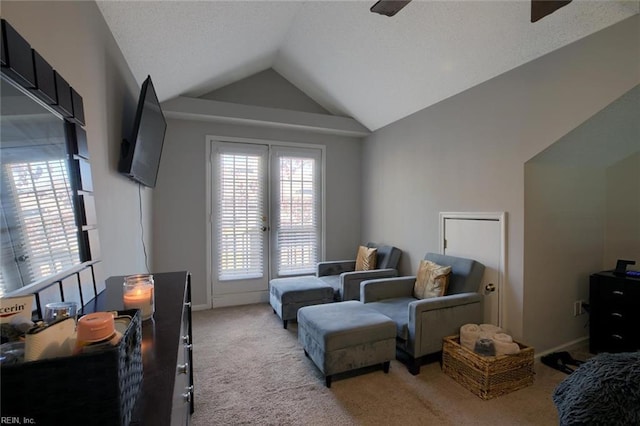 bedroom featuring lofted ceiling, light colored carpet, and ceiling fan