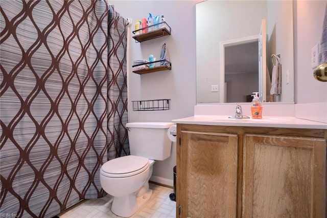 bathroom with toilet and vanity