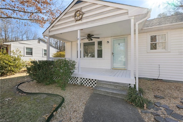 doorway to property featuring ceiling fan and covered porch