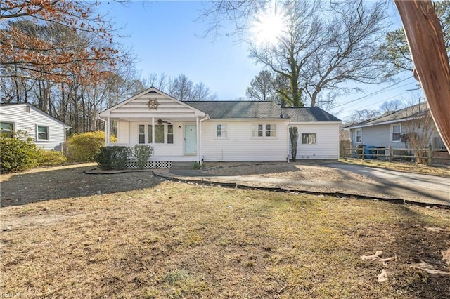 view of front facade with a front lawn and covered porch