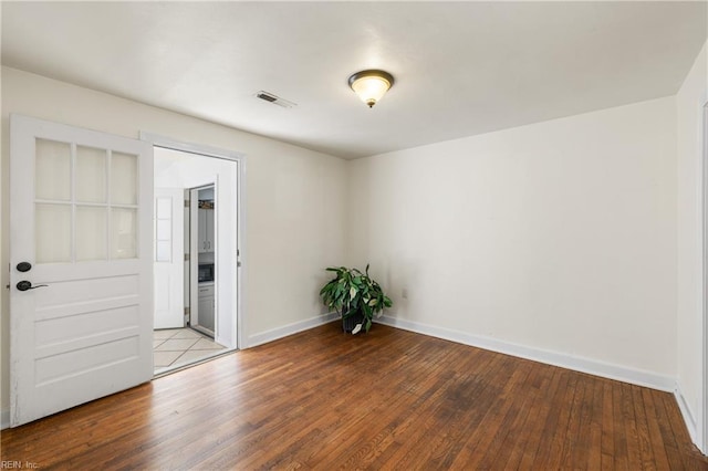 unfurnished room featuring light hardwood / wood-style floors