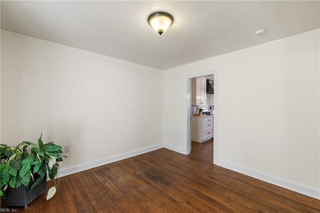 unfurnished room featuring dark hardwood / wood-style floors