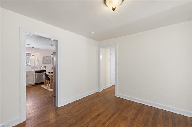 empty room featuring dark hardwood / wood-style flooring