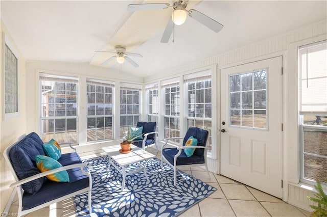 sunroom featuring lofted ceiling and ceiling fan