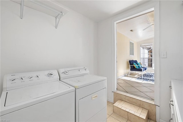 laundry room featuring ceiling fan, light tile patterned floors, and washer and clothes dryer