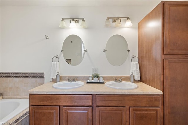 bathroom featuring tiled bath and vanity