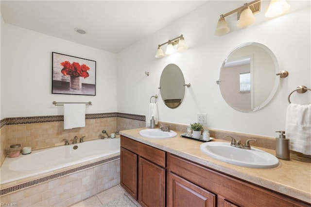 bathroom with vanity, tile patterned floors, and a relaxing tiled tub