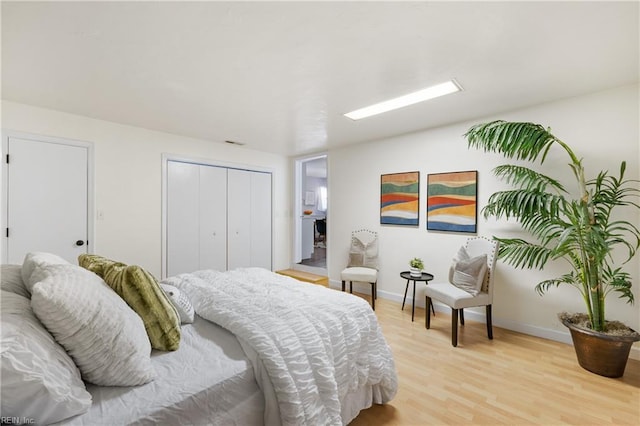 bedroom with light hardwood / wood-style floors